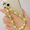 Perlen Handykette Happy Smile -Herz Schmuck Geschaft handyketten perlenkette smileys weisse perlen kunstperlen smartphone telefon accessoires kette stern happy smile weiss gelb 1 219844